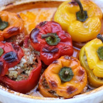 cooked yellow, orange and red peppers in a baking dish
