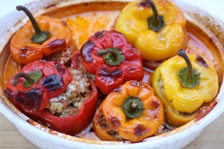 cooked yellow, orange and red peppers in a baking dish