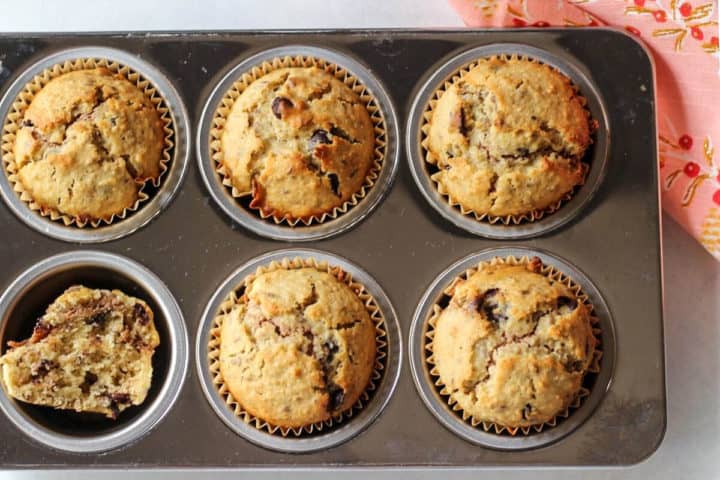 6 chocolate almond butter muffins in a baking muffin pan.