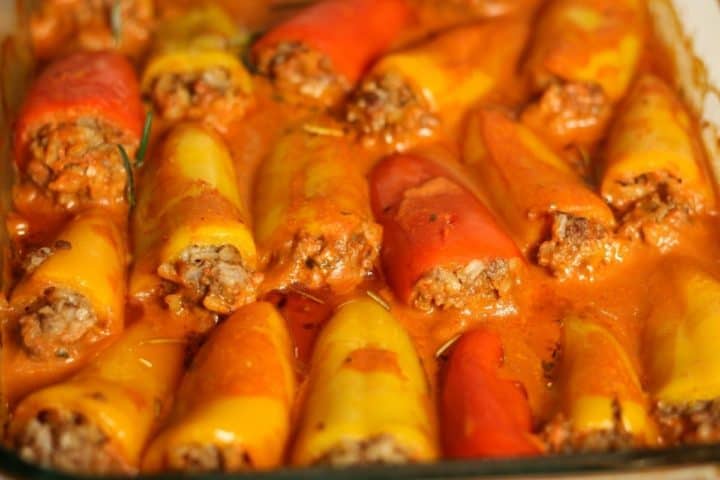 Close up shot of stuffed mini peppers with baked with the sauce.