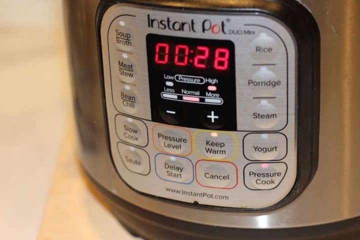 Instant pot front side with timer set 28 minutes for preassure cook on high.