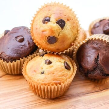 Small batch chocolate chip muffins on a wooden board.