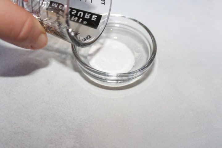 Process shot #2: apple cider vinegar bein poured into baking soda to create a bubbly leavening agent.