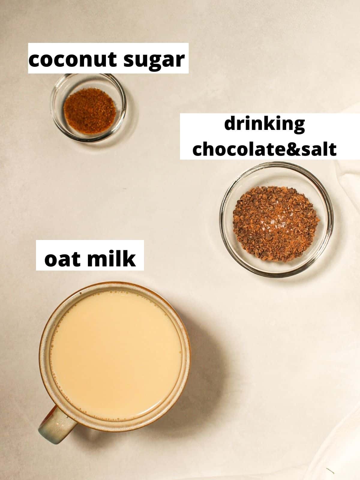 Labeled recipe ingredients on a white background. From top to bottom: coconut sugar, chocolate crumbles with salt, oat milk.
