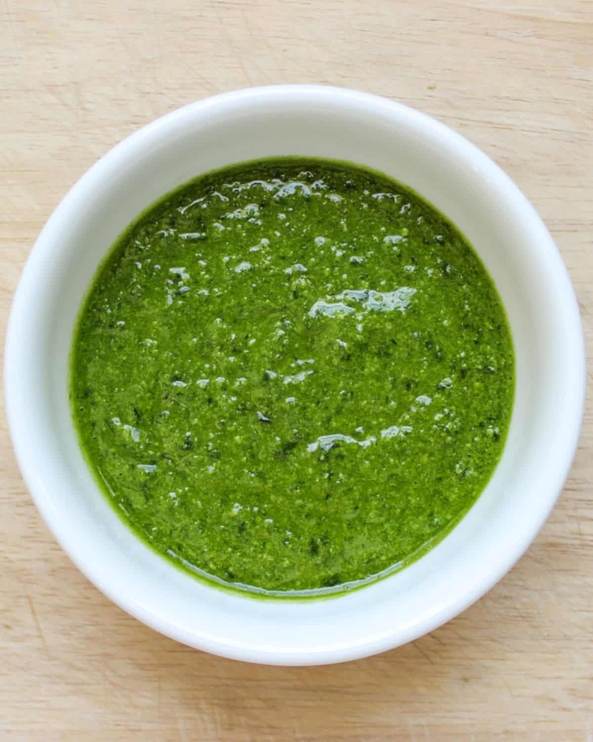 Lemon basil pesto in a white bowl.