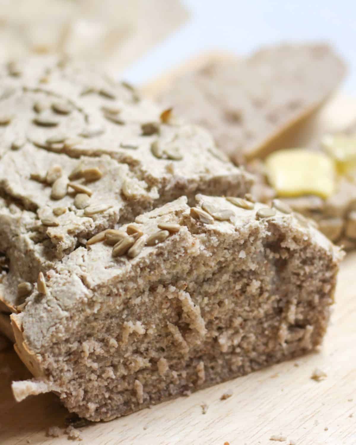 Grey buckwheat bread topped with sunflower seeds. 