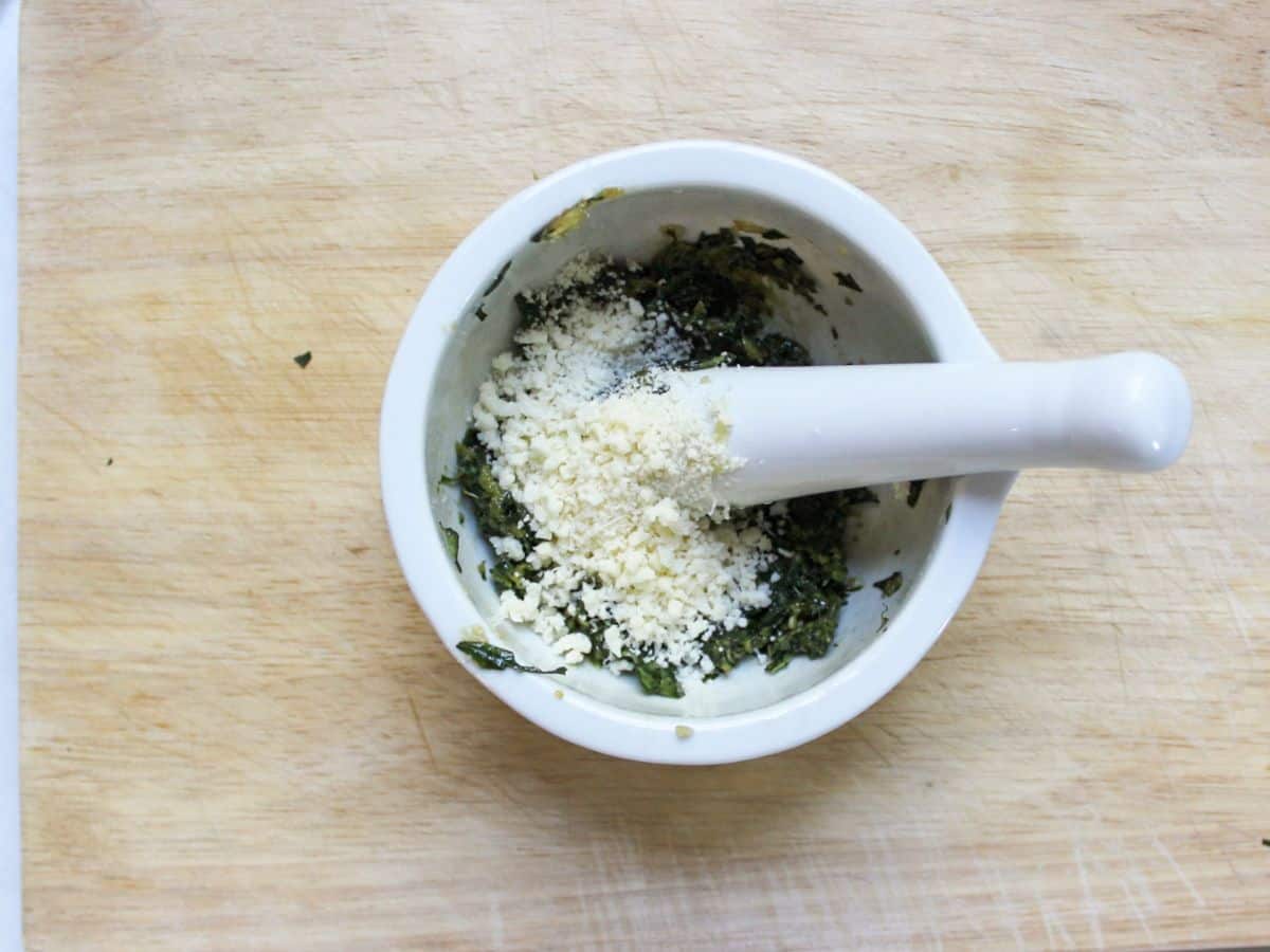 Grated Parmesan added to the basil.
