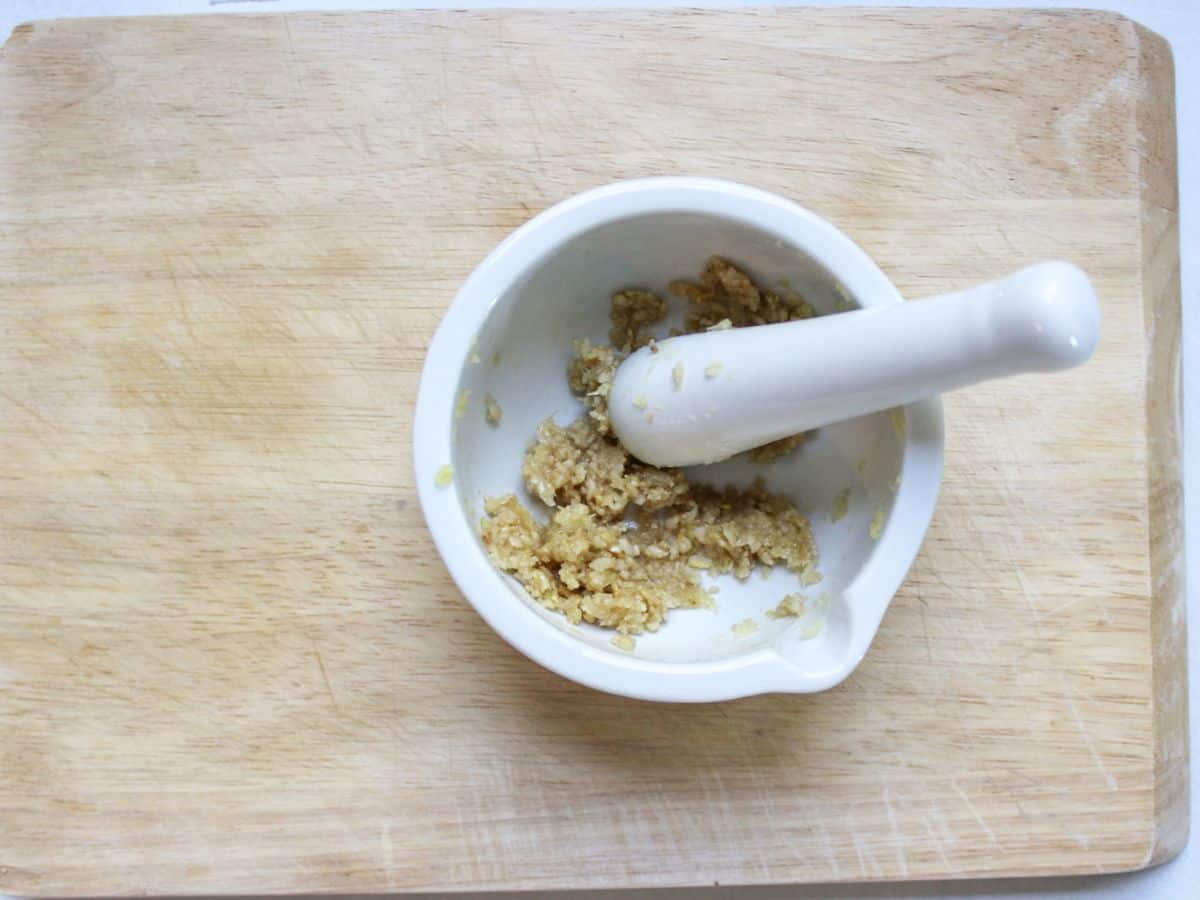 Crushed into paste garlic and salt in a mortar with pestle in it.