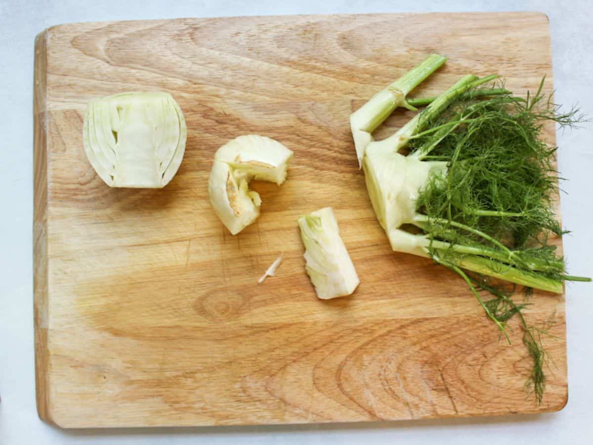 Fennel bulb cut in half, with the root and fronds trimmed.