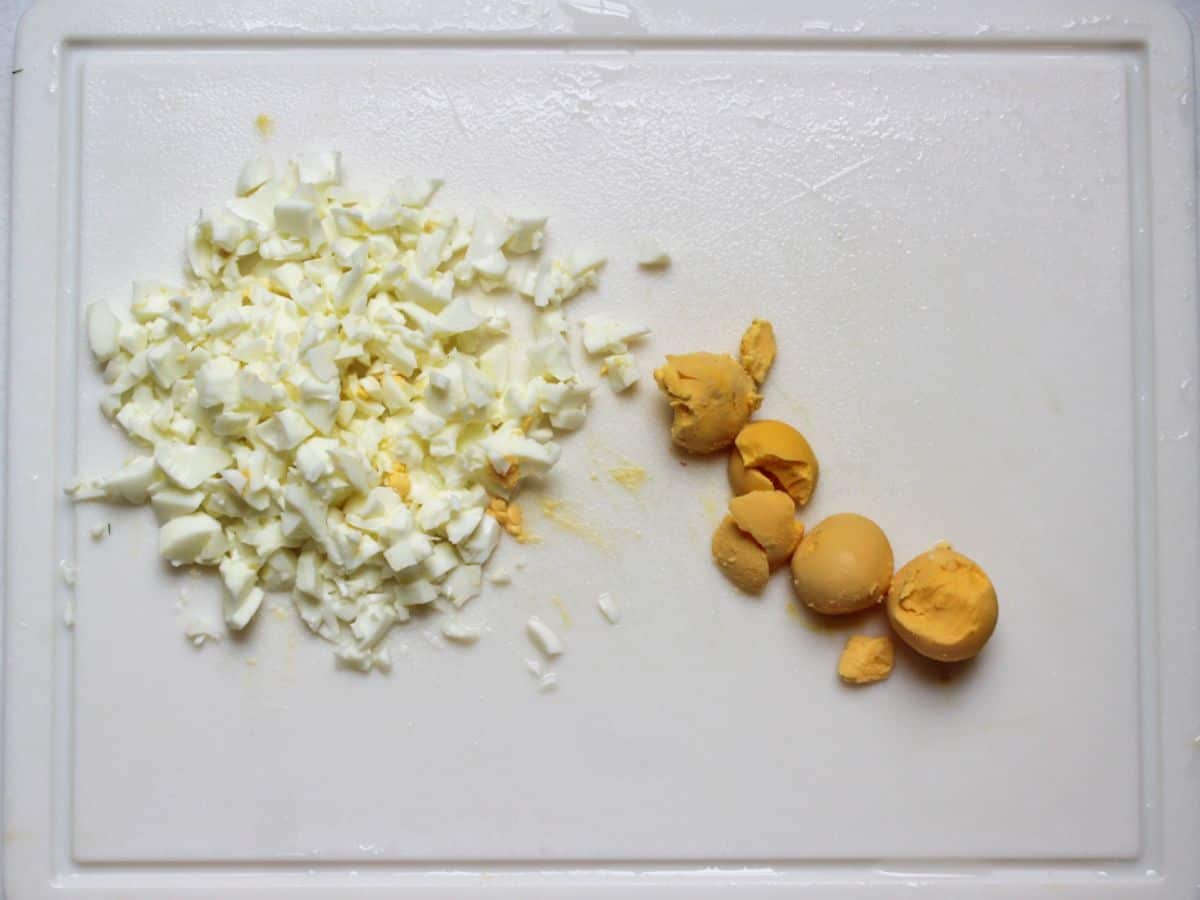 Hard boiled eggs with whites and yolk separated. Whites are diced.