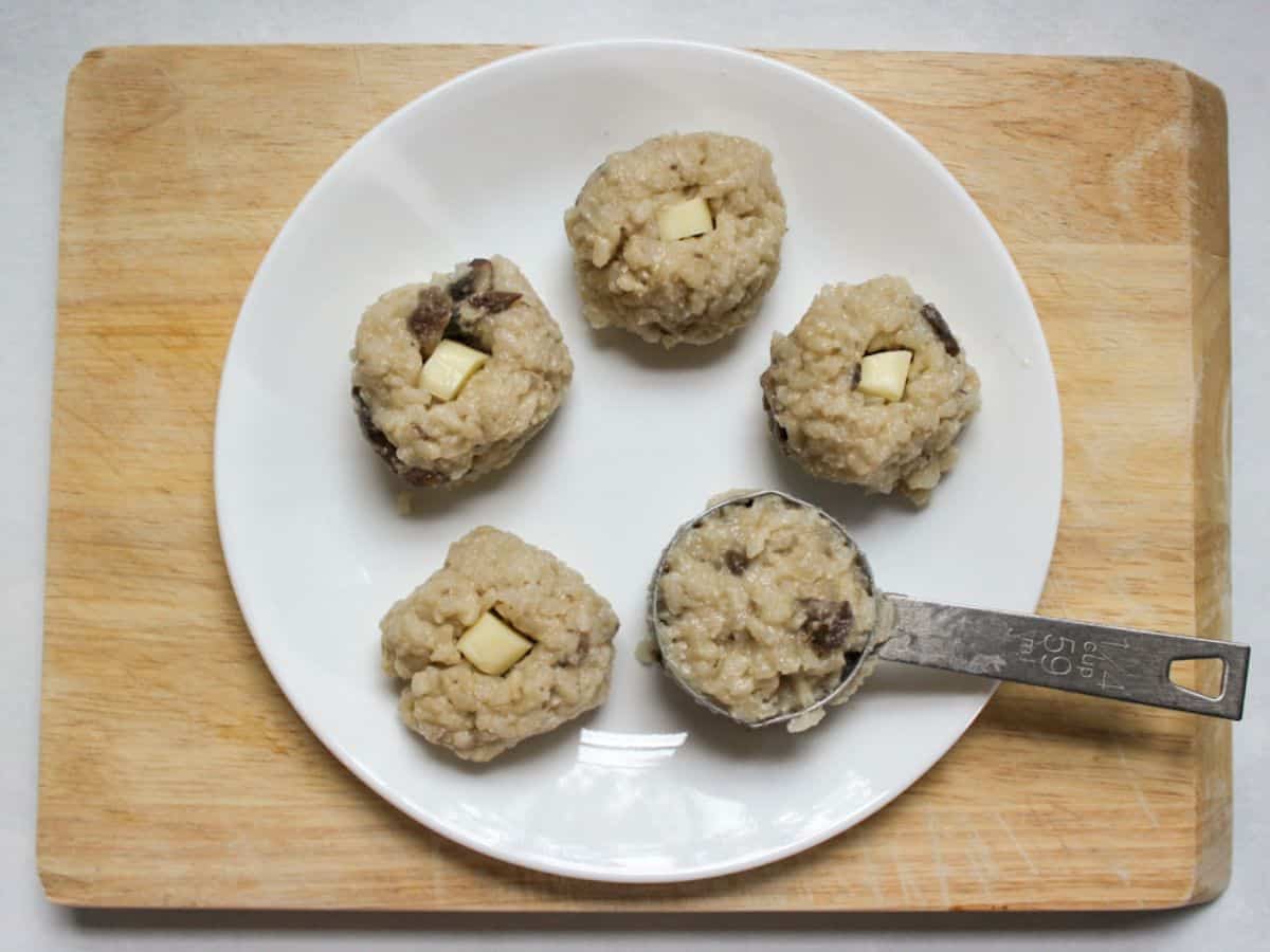 Formed risotto balls with cheese stuffed in them.