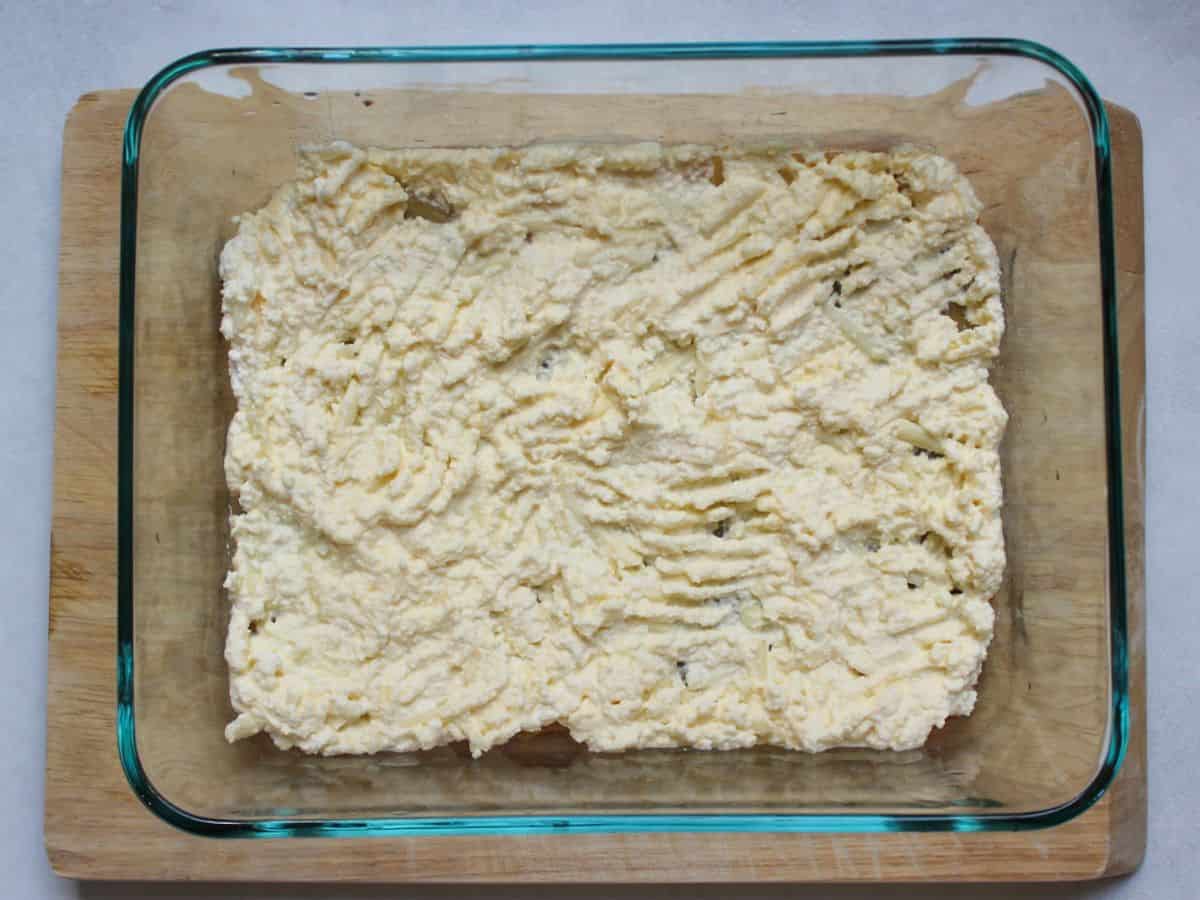 Layer of ricotta cheese mixture on top of the noodles.