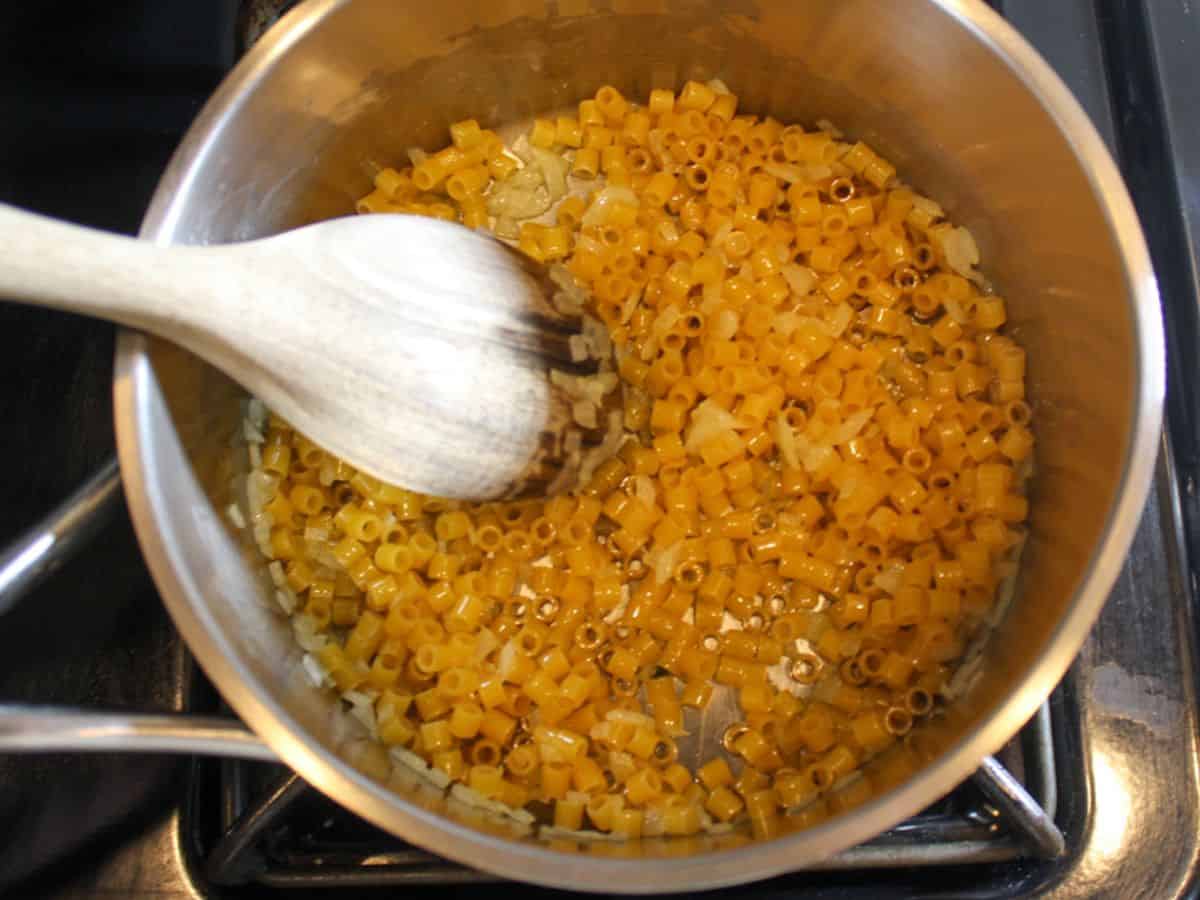 Small ditalini pasta added to the pot.