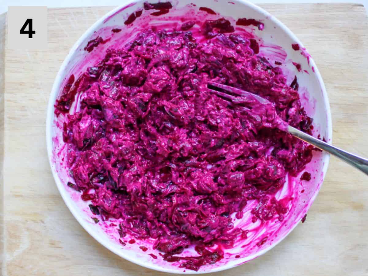 Creamy yogurt mixed into the grated beets.