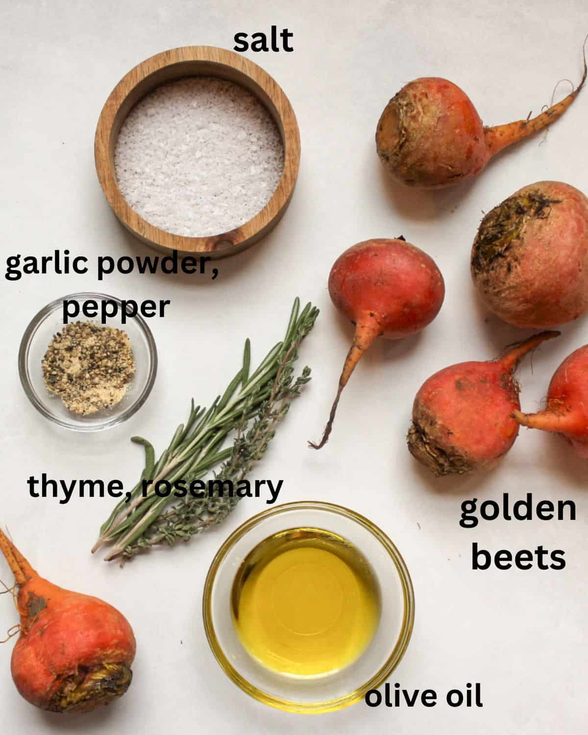 Recipe ingredients on a white background labeled as salt, garlic powder, pepper, thyme, rosemary, olive oil, golden beets.