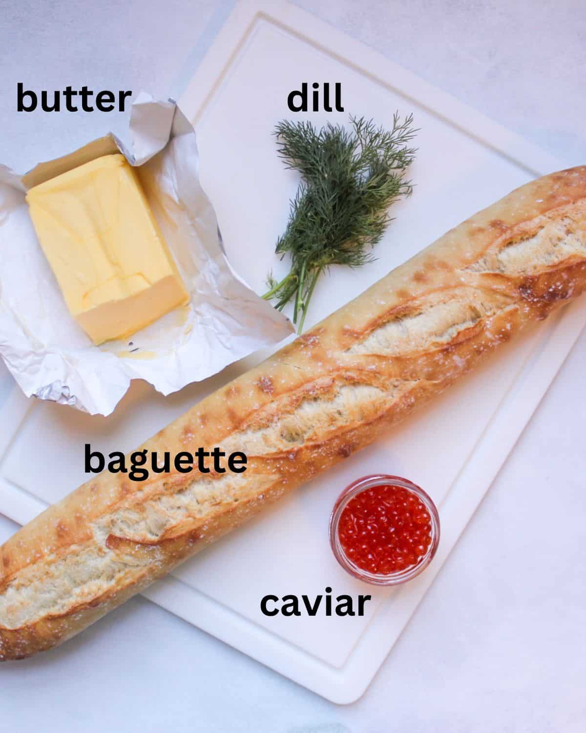 Recipe ingredients on a white background labeled as butter, dill, baguette, caviar.