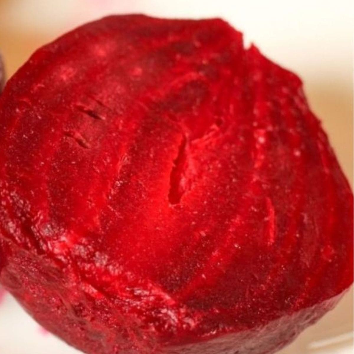Microwave cooked whole red beet cut in half.