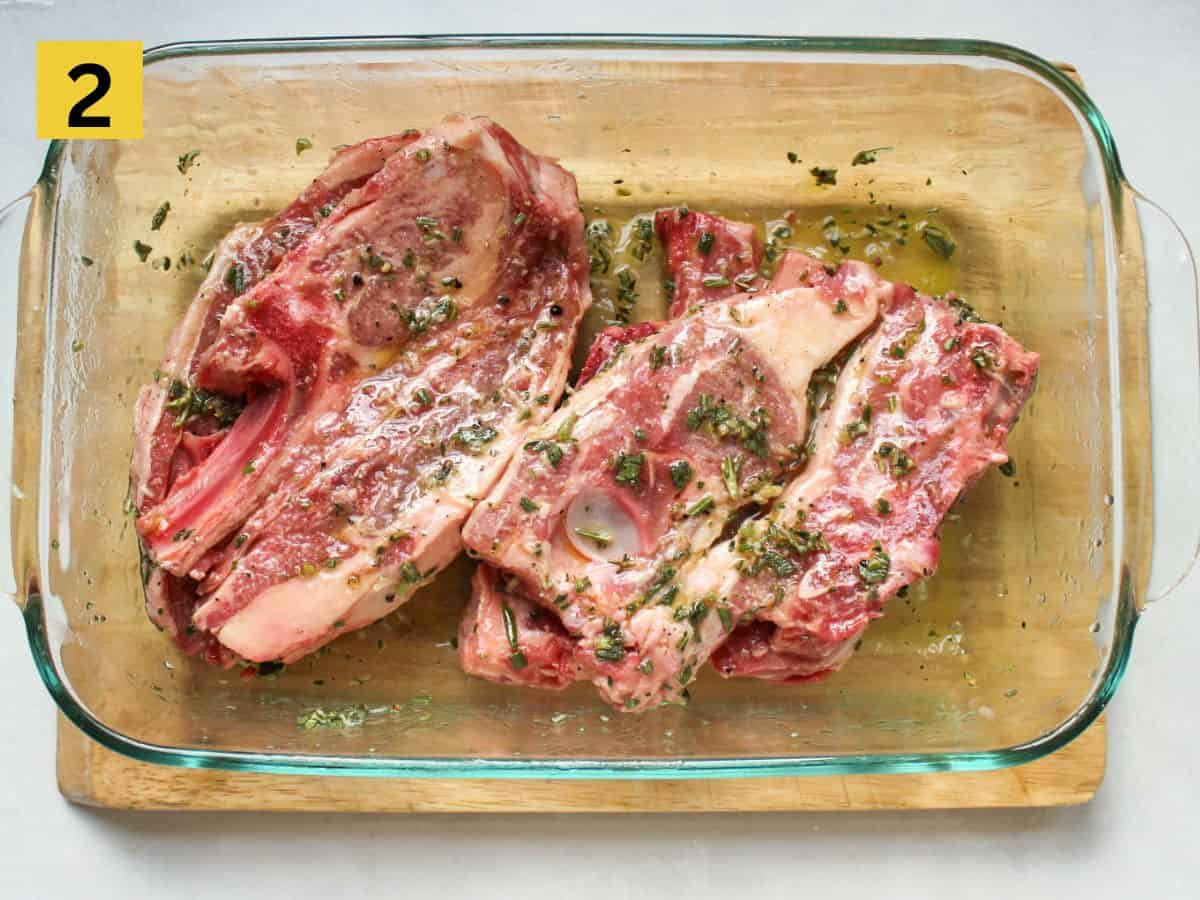 Lamb chops added to the glass container and coated with the marinade.