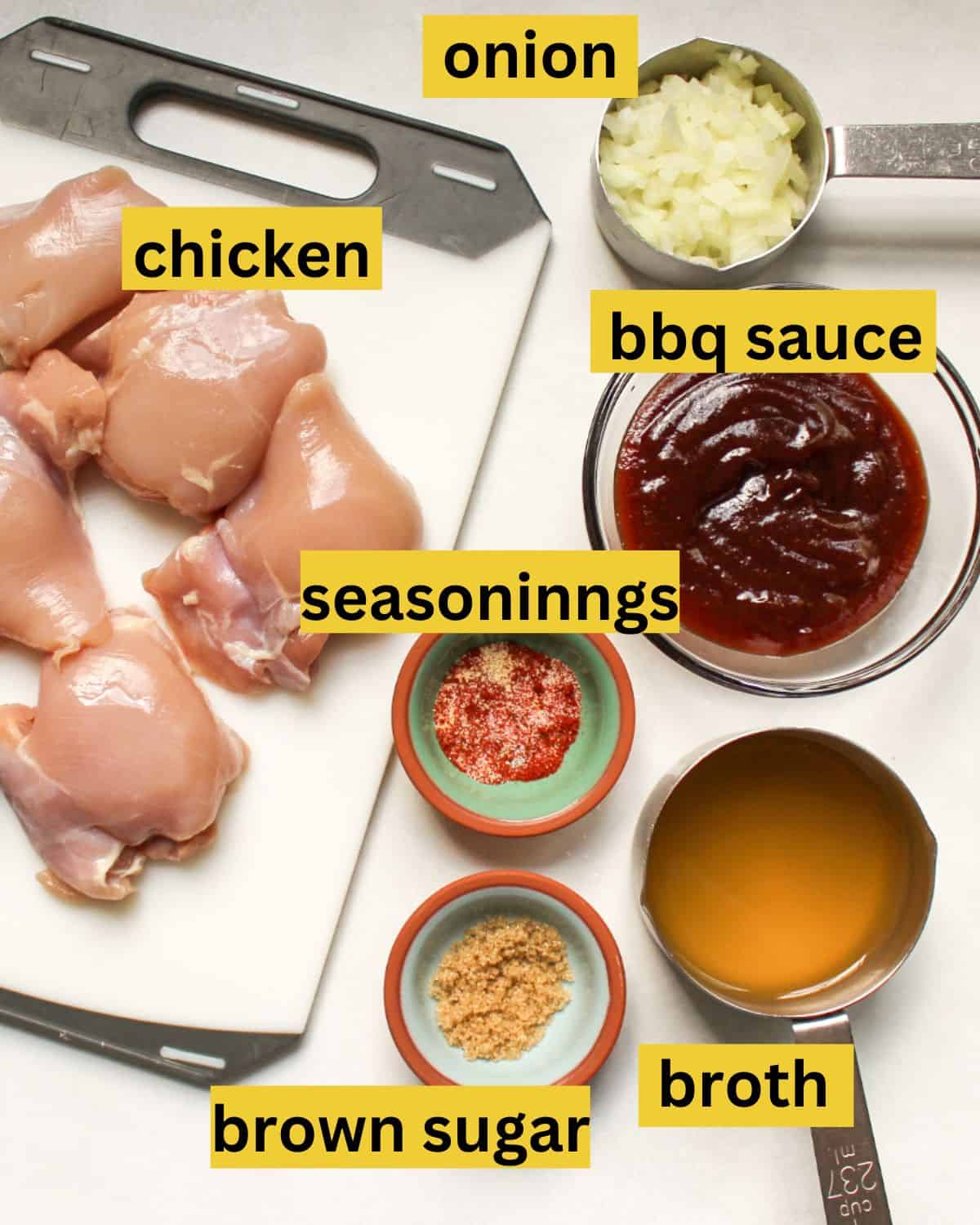 Instant pot pulled BBQ chicken thighs measured recipe ingredients on a white background. 