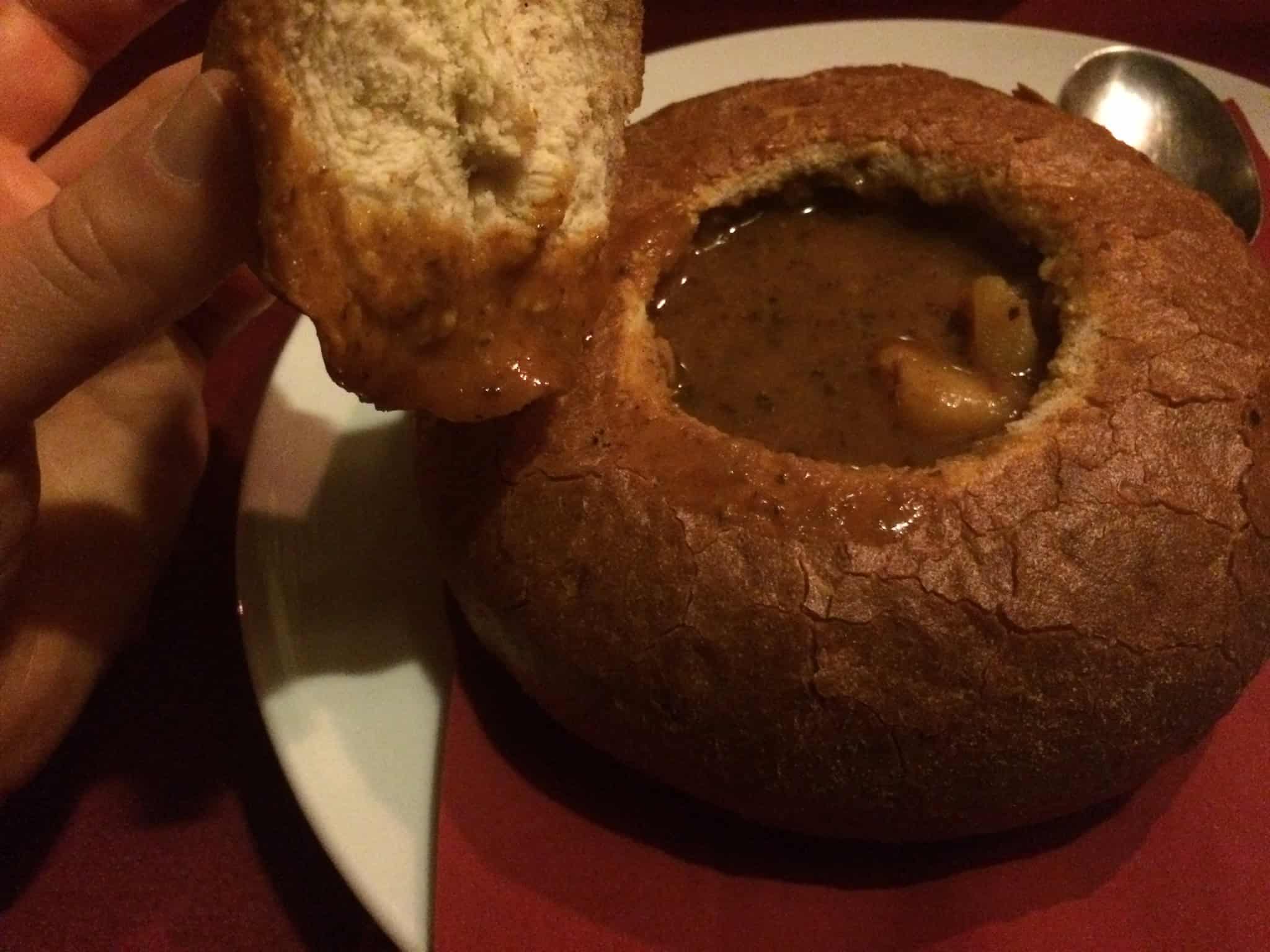 Traditional Czech goulash served in a bread bowl.