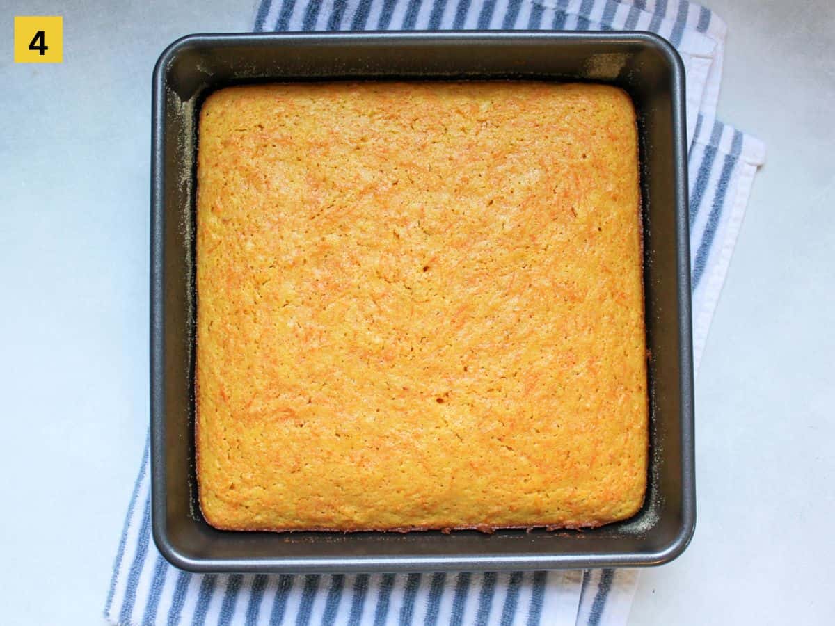 Unfrosted golden carrot cake in square baking pan.