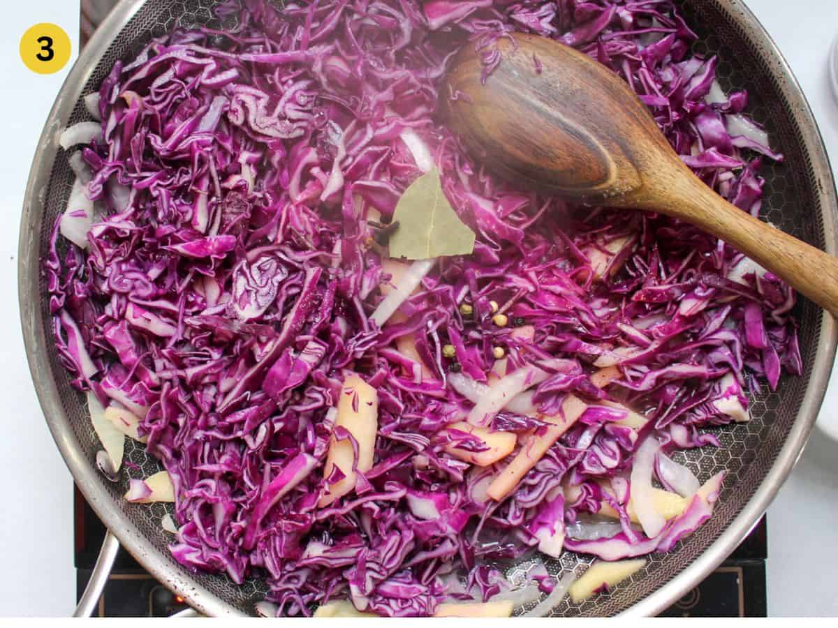 Shredded red cabbage added too the skillet.