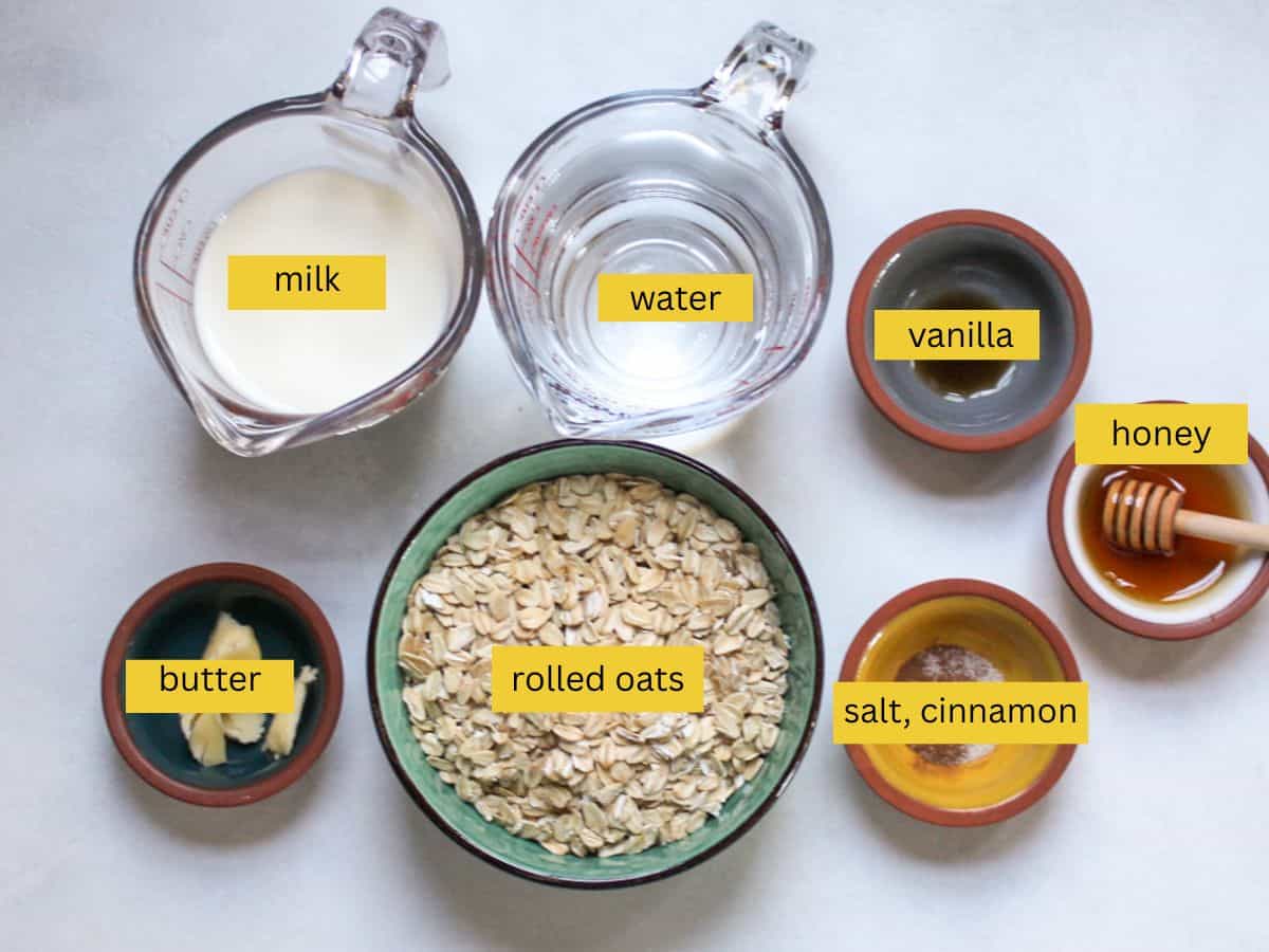 Ingredients for honey oatmeal measured out, including rolled oats, milk, water, honey, butter, vanilla, cinnamon, and salt.