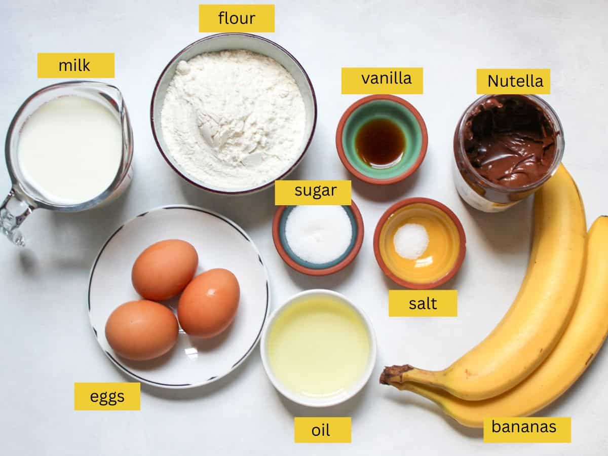Measured ingredients for making crepes with banana and Nutella filling.