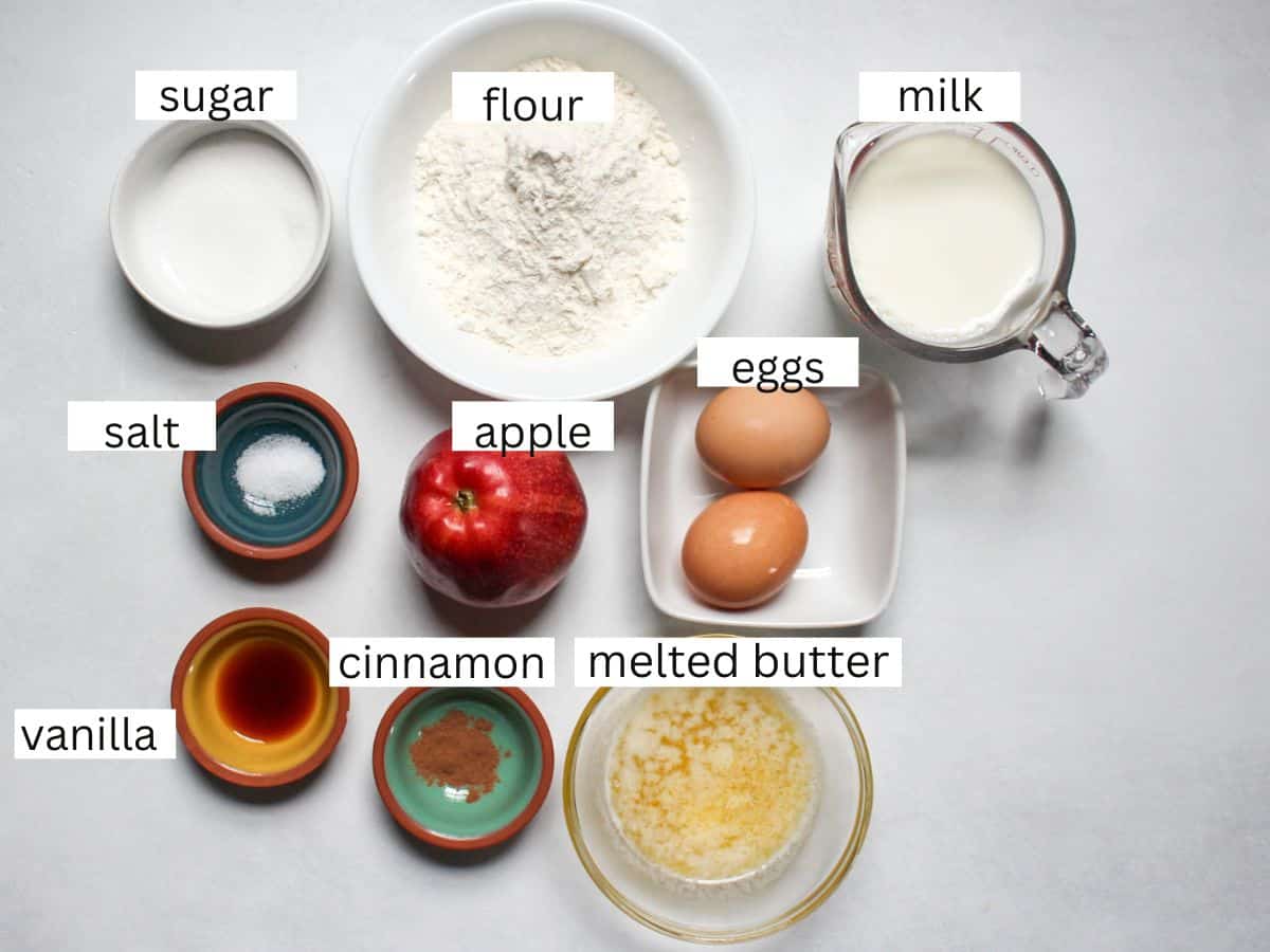Measured recipe ingredients on a white background for making apple cinnamon crepes. 