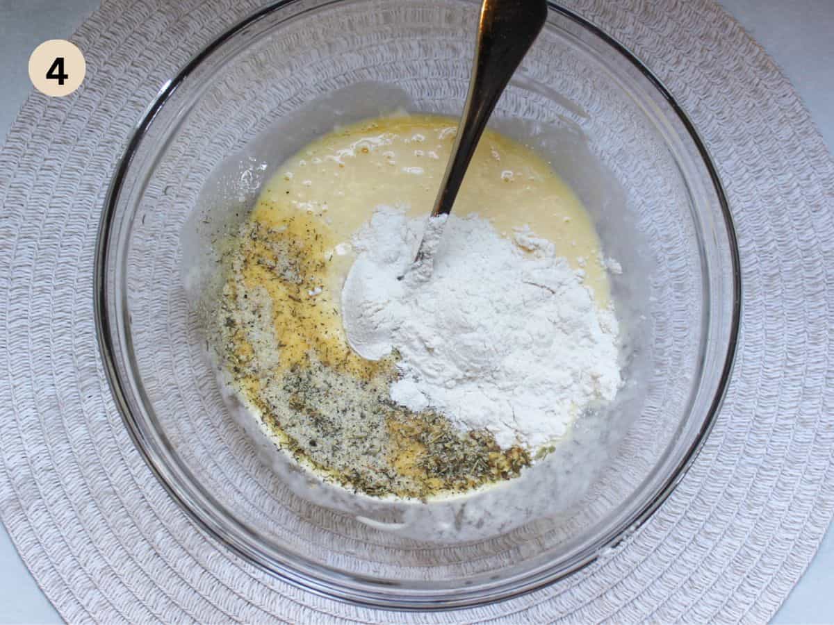 Whisking ranch flavored batter in a large bowl.