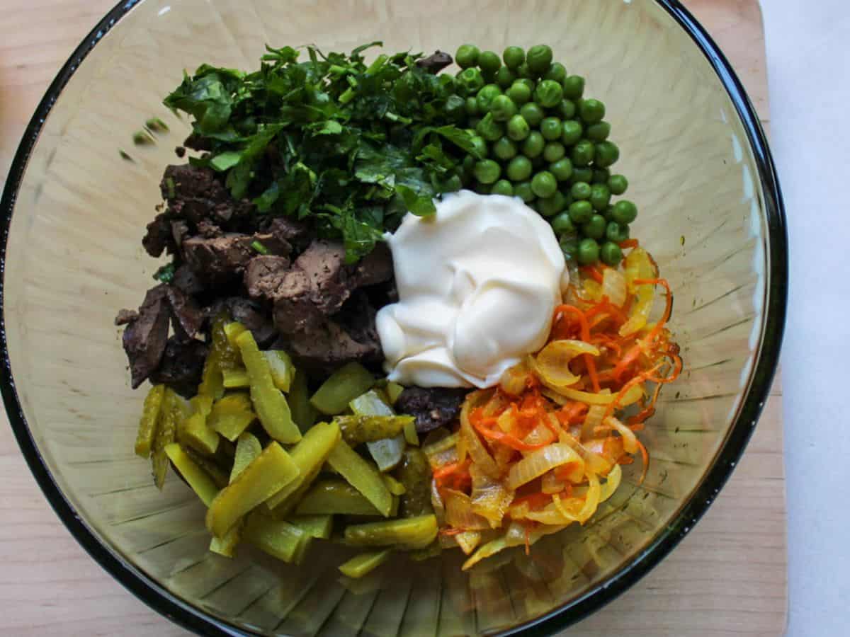All salad ingredient and mayo added to the large glass bowl.