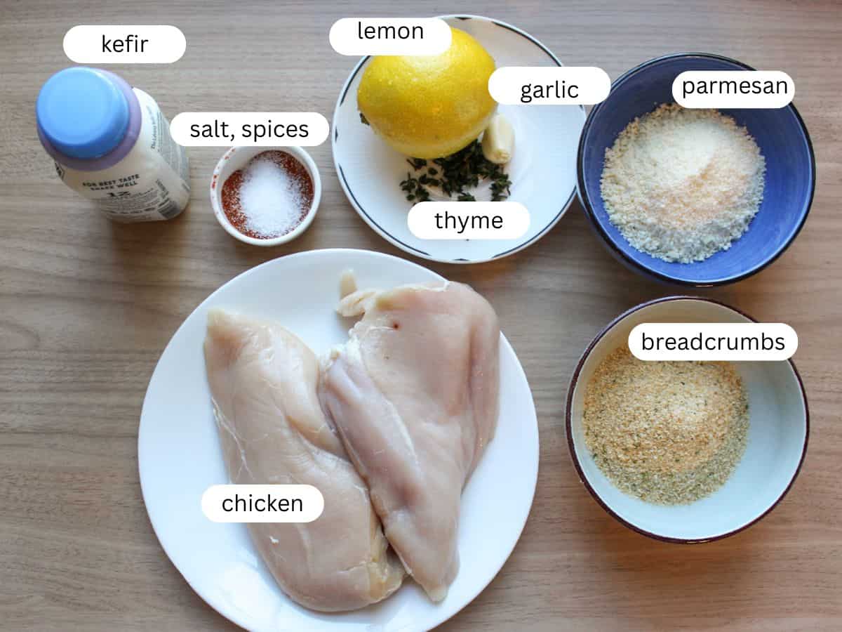 Ingredients for garlic Parmesan chicken skewers on a wooden table. 