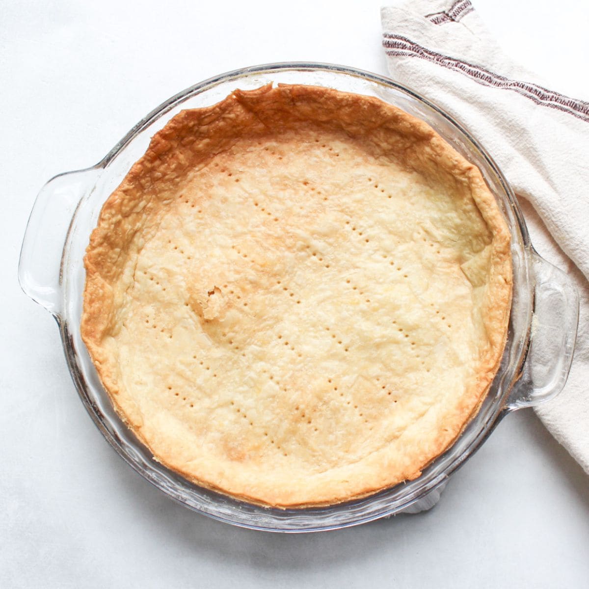 Classic French pâte brisée tart crust in a 9-inch baking pan.