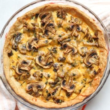 Homemade savory mushroom tart with flaky crust, mushrooms and cheese.