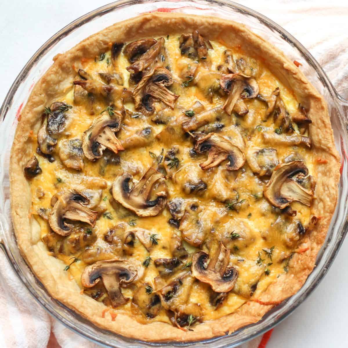 Homemade savory mushroom tart with flaky crust, mushrooms and cheese.
