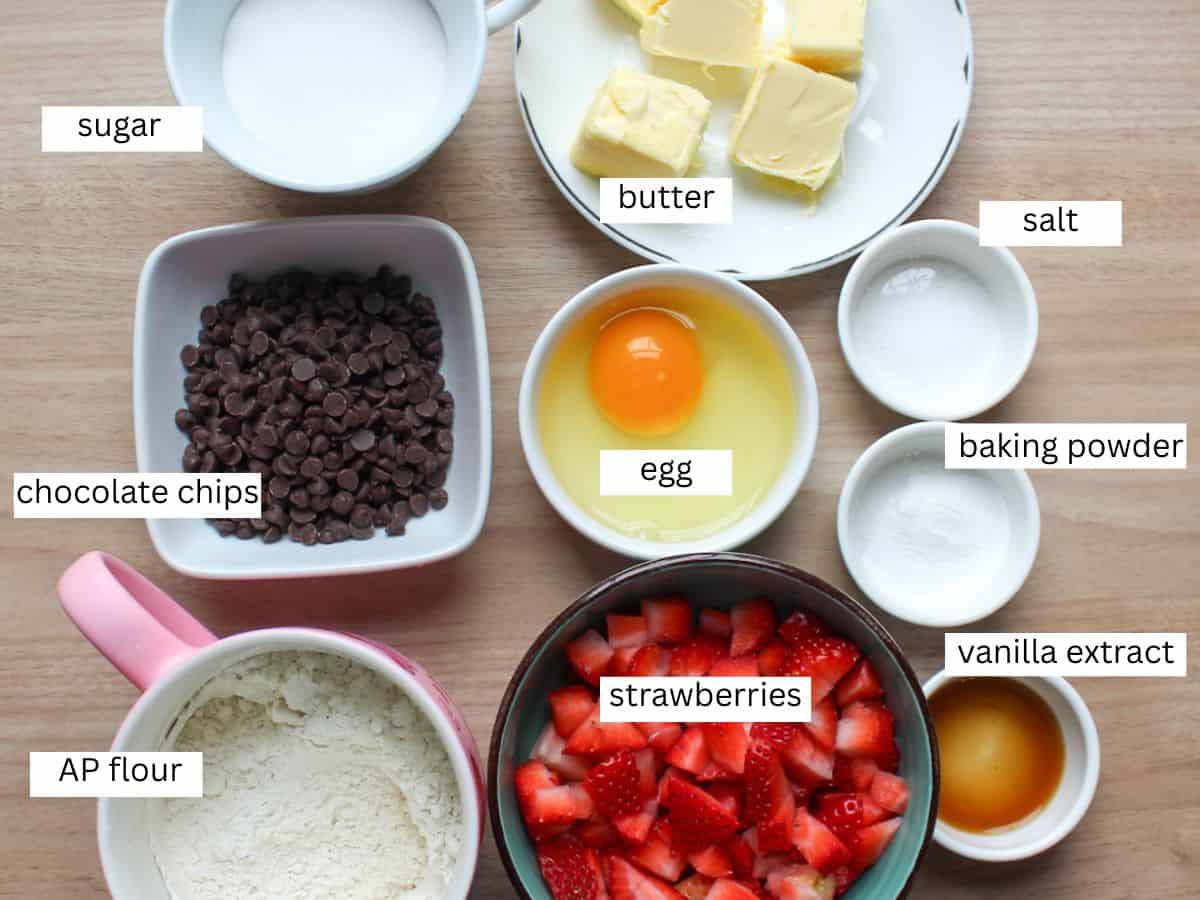 Fresh strawberry chocolate chip cookies ingredients on a white background.