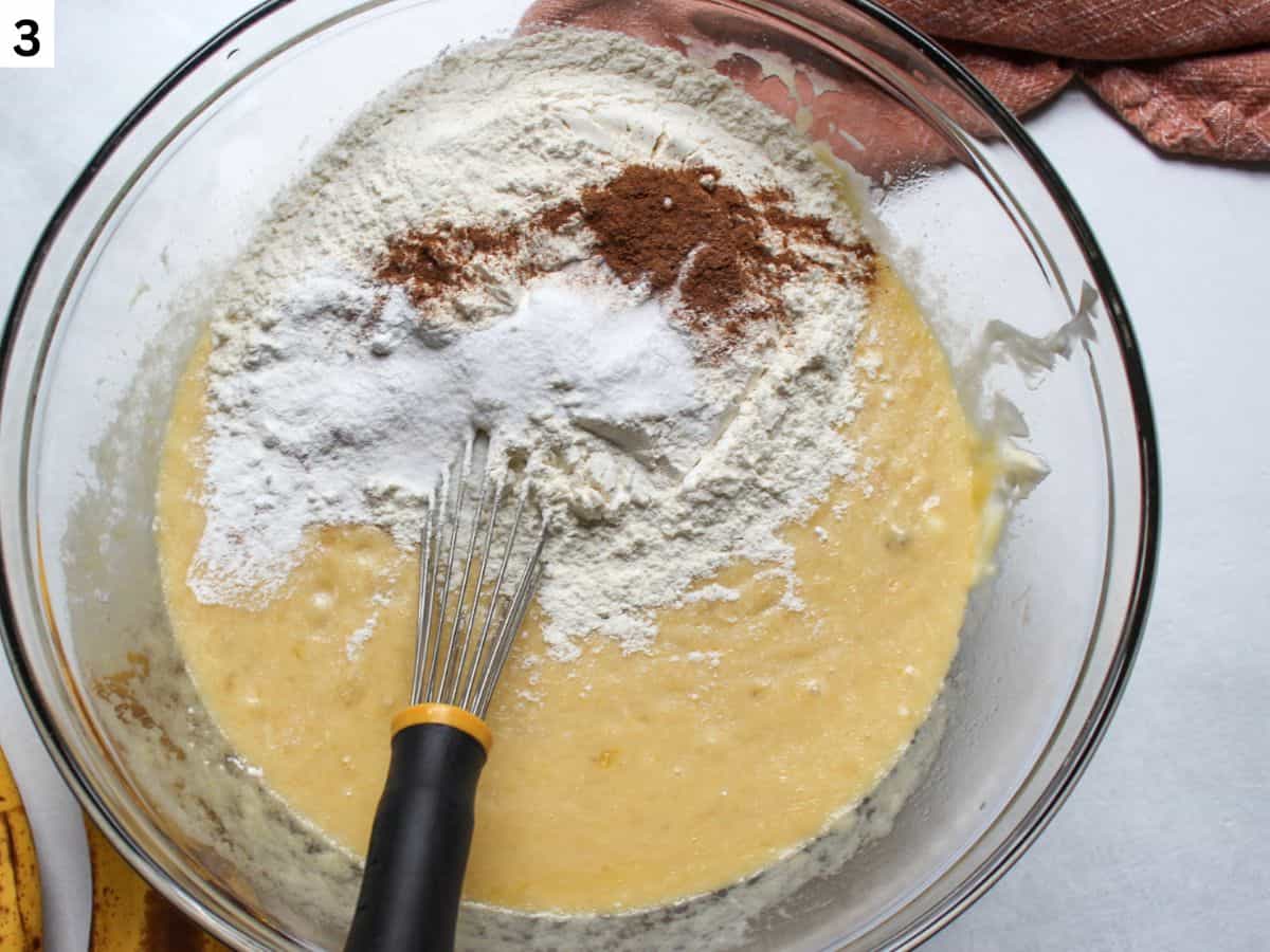 Adding dry ingredients to the wet ingredients. 