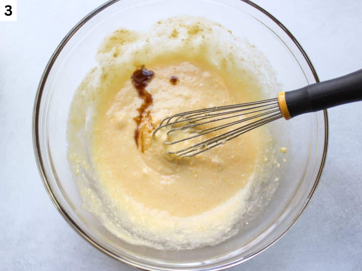 Vanilla extract added to wet ingredients in a mixing bowl 