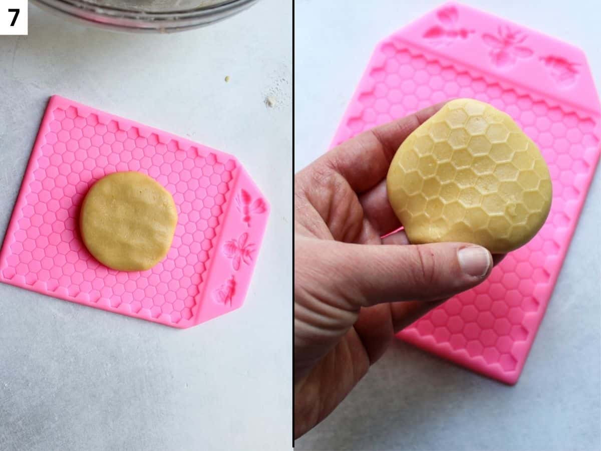Pressing cookie dough into a honeycomb silicone mold to form a honeycomb pattern on top.