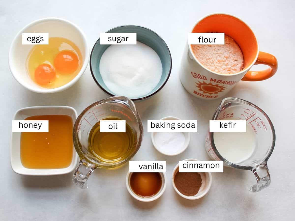 Recipe ingredients on a white background for making the best honey muffins. 