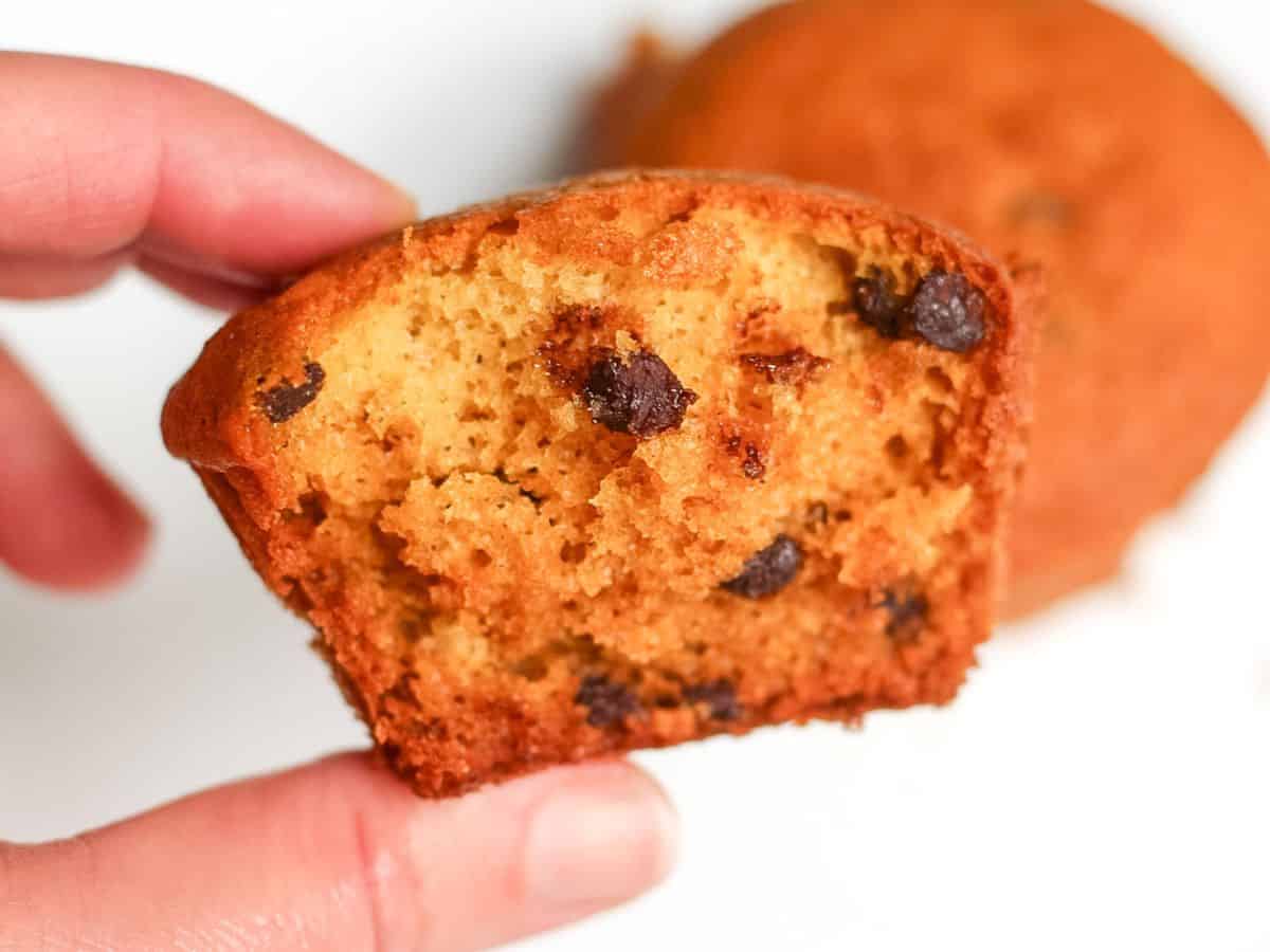 Honey muffin split in half, showing the golden soft crumb inside. 