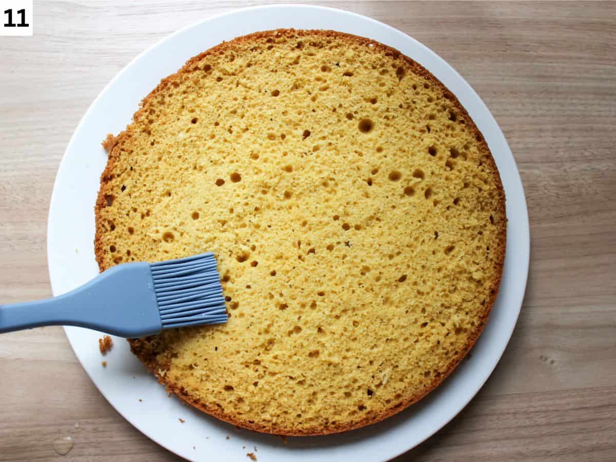 Brushing the honey soak on the sliced sponge cake.