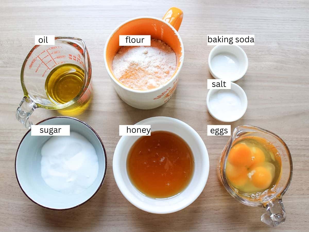 Honey sponge cake recipe ingredients including eggs, sugar, honey, baking soda, oil flour and salt. 
