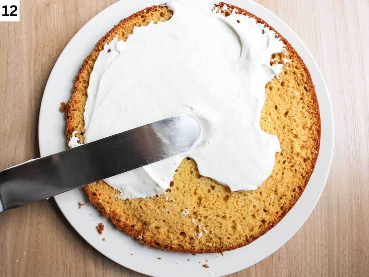 Spreading the frosting on the honey sponge cake first layer. 