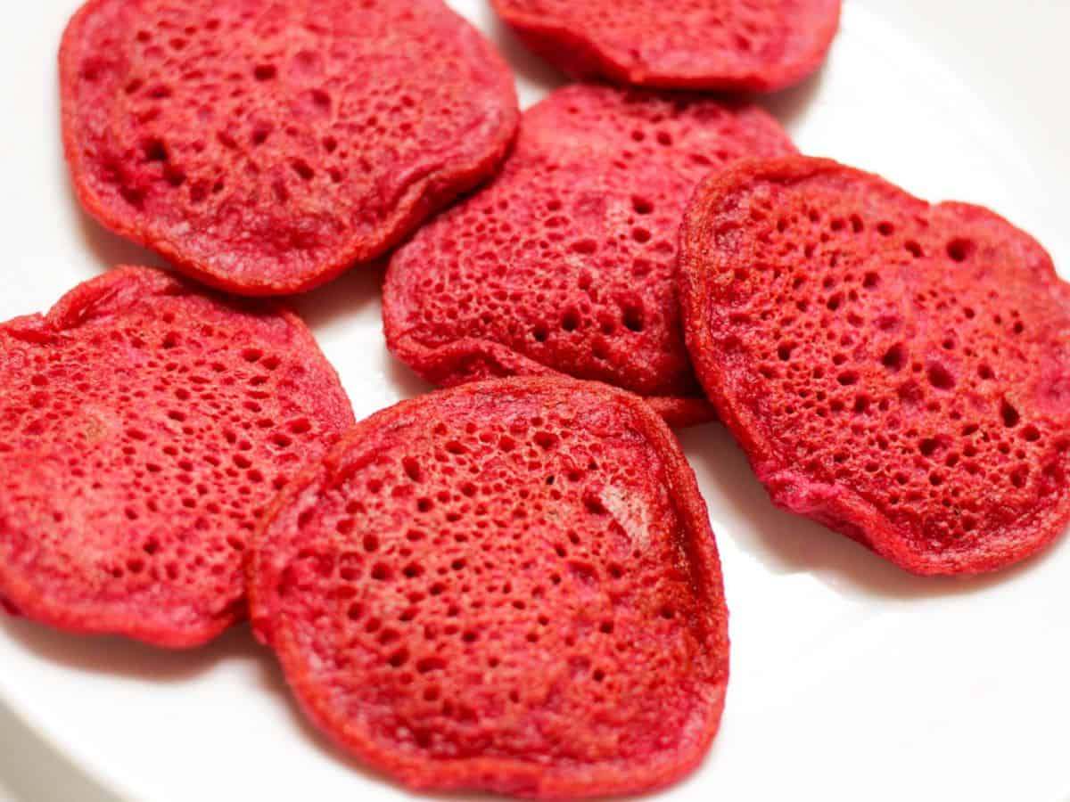 Small beetroot pancakes served on a plate. 