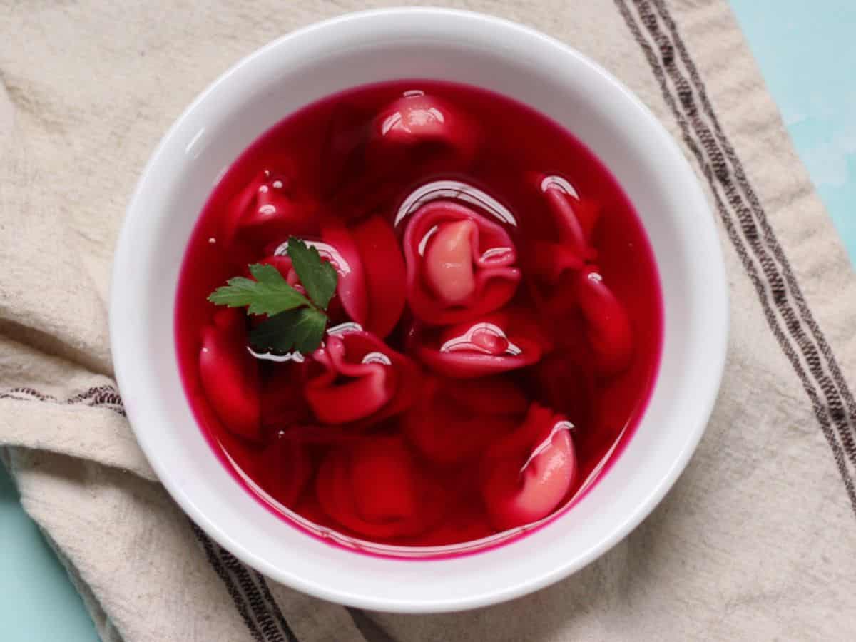 Polish clear borscht serve in a bowl with small dumplings. 