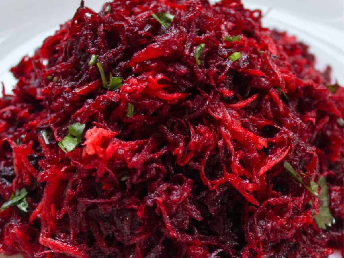 Grated raw beet salad in a bowl. 
