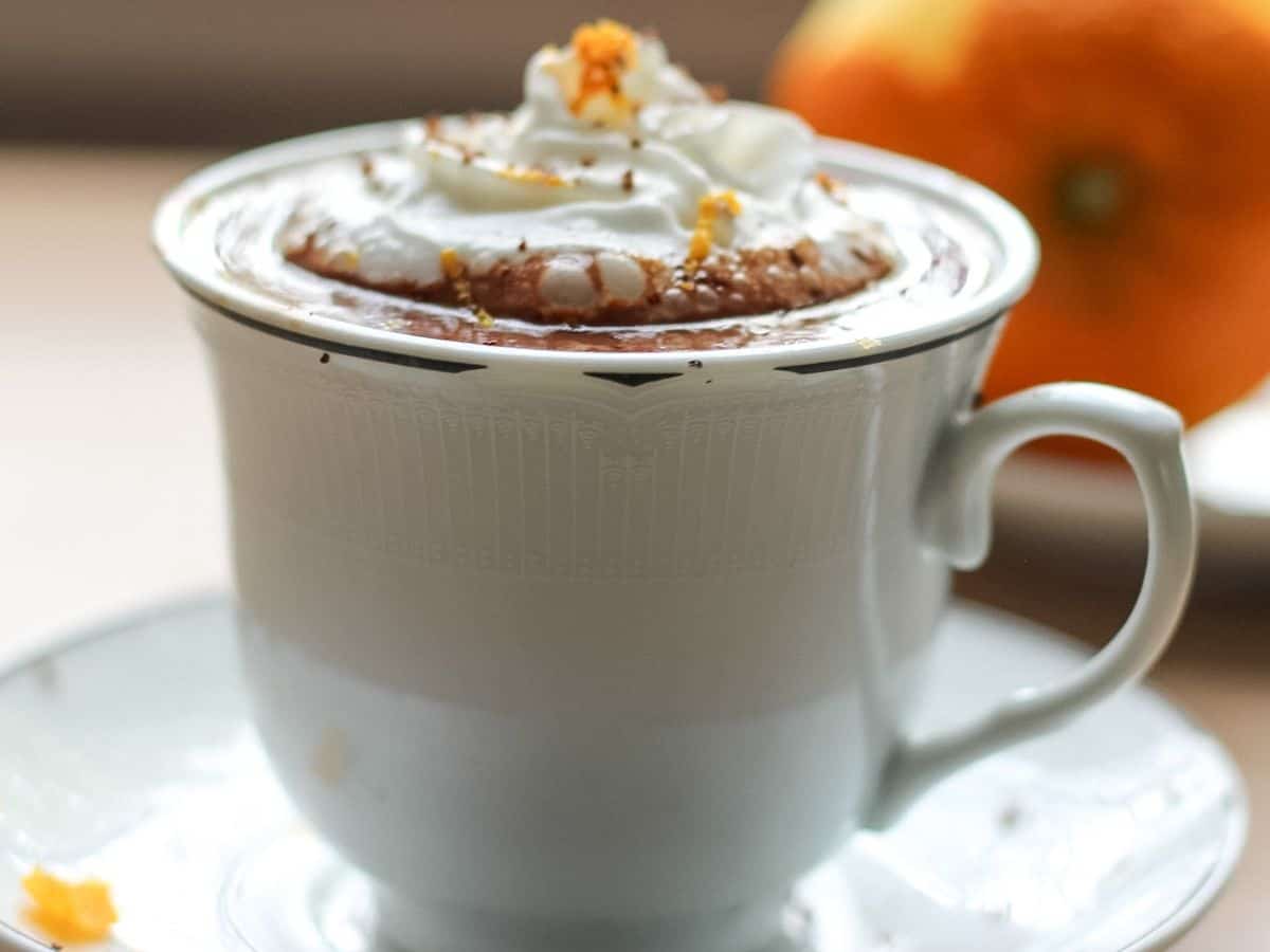 European hot chocolate served in a cup, topped with whipped cream and grated chocolate.