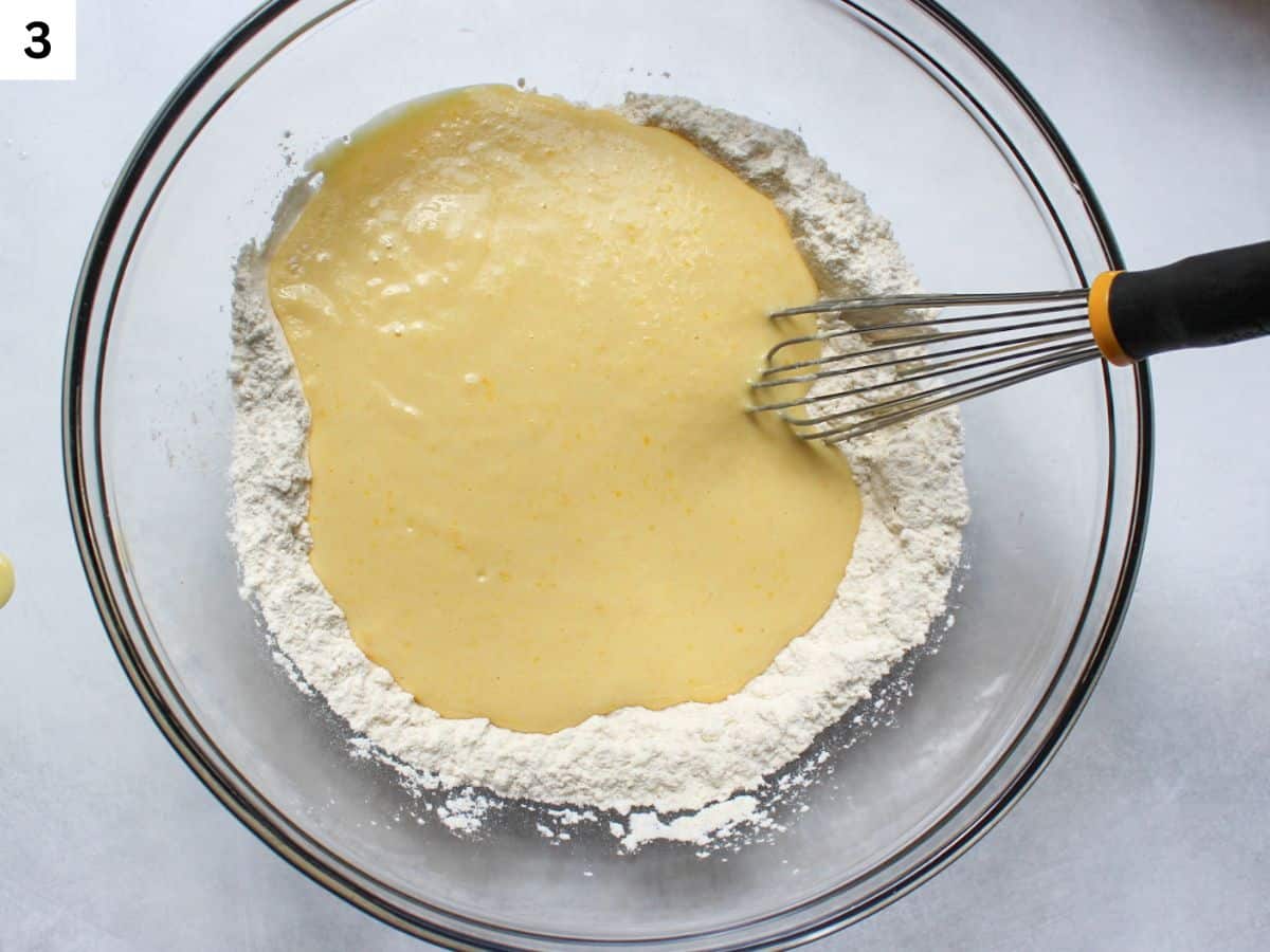 Wet muffin ingredients poured over dry ingredients.