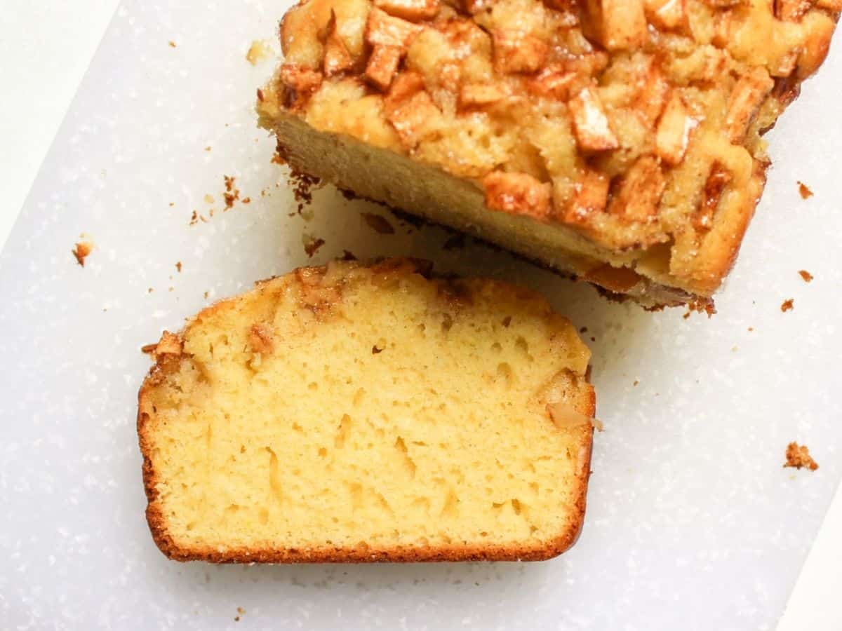Fresh apple bread sliced on cutting board. 
